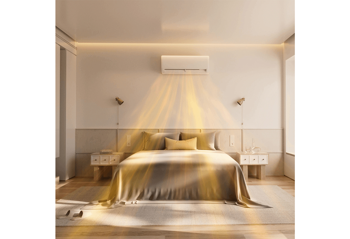 Απεικονίζεται το κλιματιστικό σε λειτουργία σε υπνοδωμάτιο πάνω από ένα κρεβάτι.